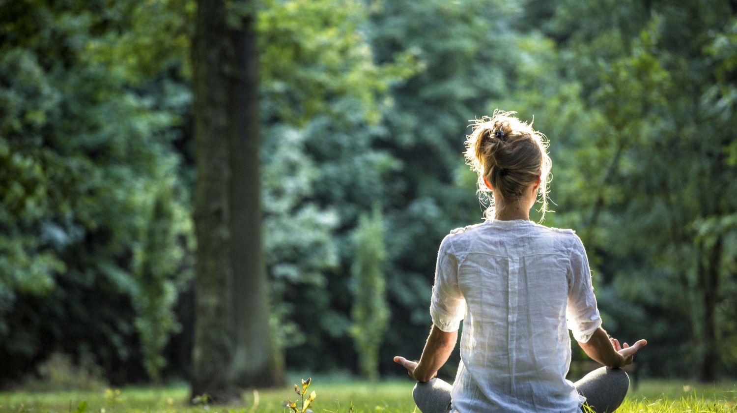 woman doing yoga outside