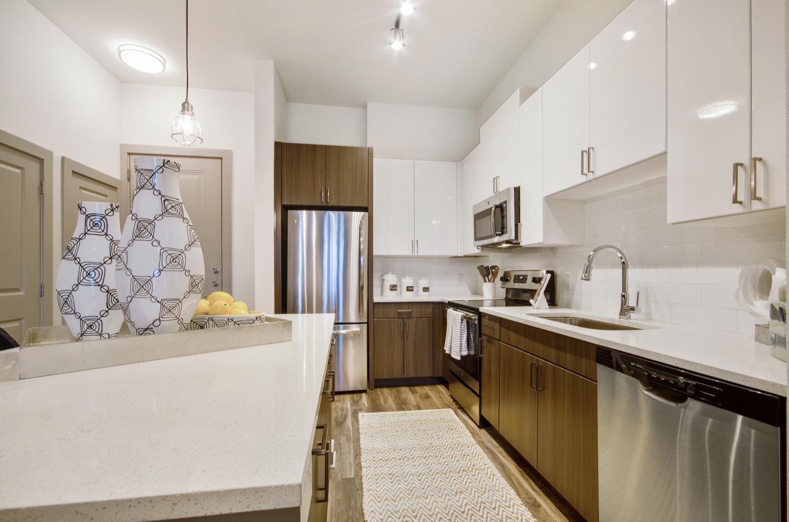 Kitchen with stainless steel appliances and tile backsplash