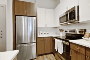 Kitchen with stainless steel appliances and tile backsplash