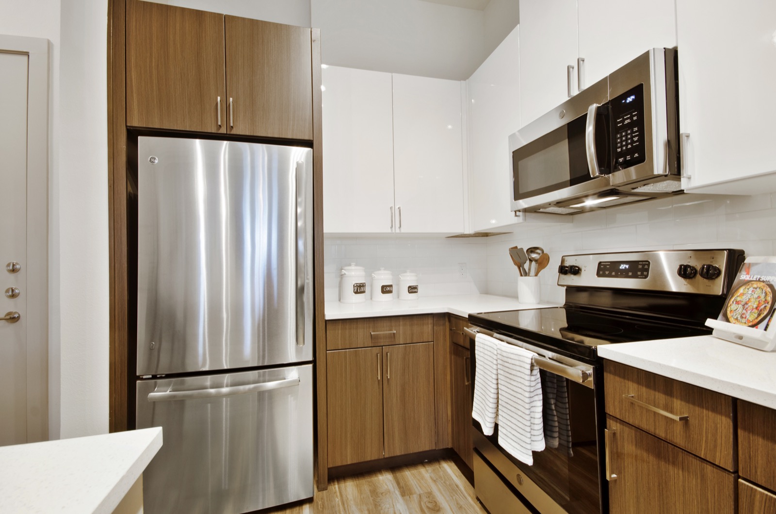 Kitchen with stainless steel appliances and tile backsplash