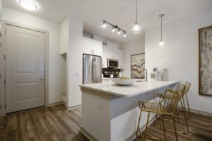 Kitchen with stainless steel appliances and tile backsplash