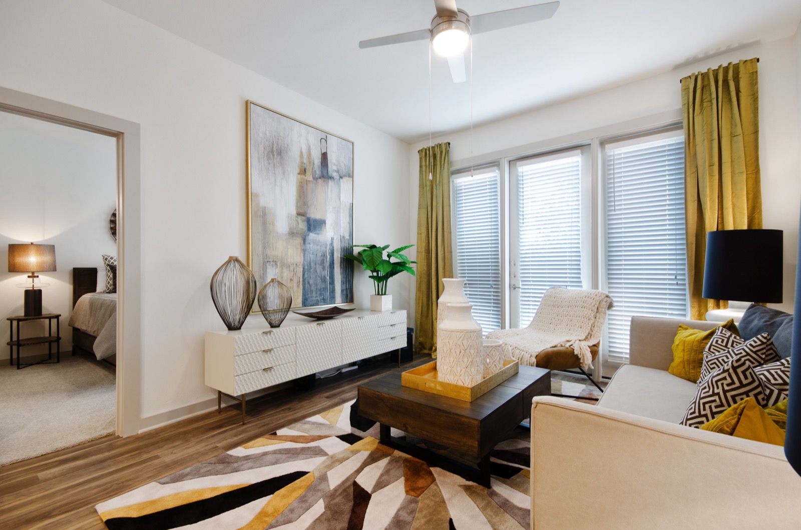 Open floor plan living room with large windows