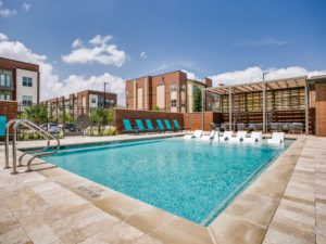 Pool with tanning ledge and deck seating