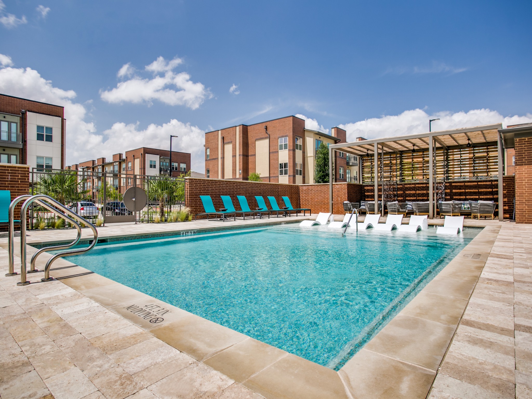 Pool with tanning ledge and deck seating