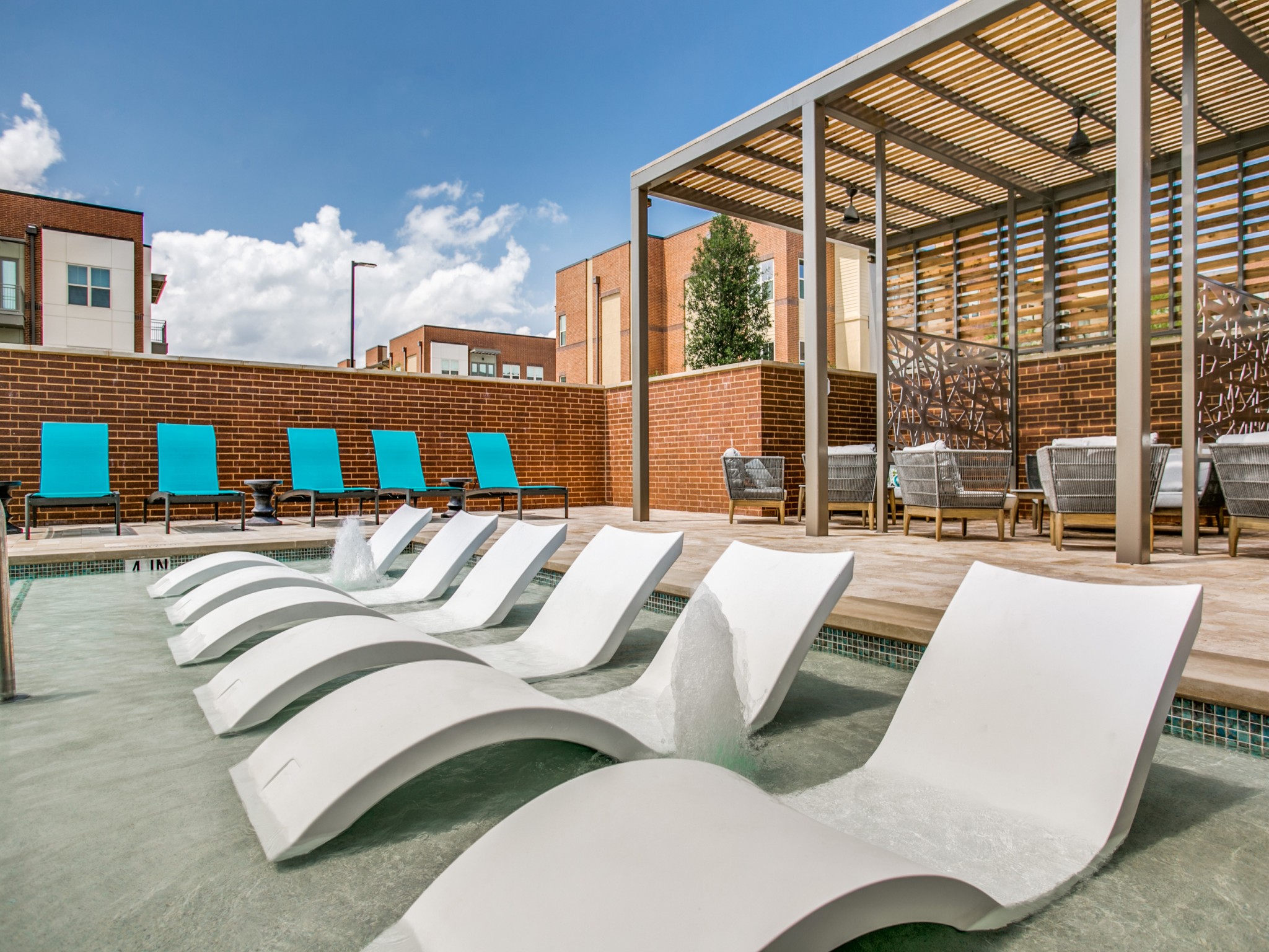 Pool with tanning ledge and deck seating