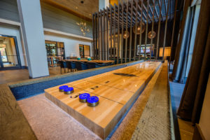 Clubroom with shuffleboard table