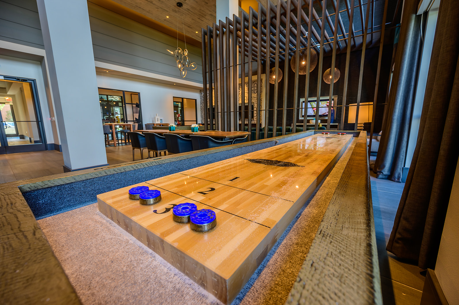 Clubroom with shuffleboard table